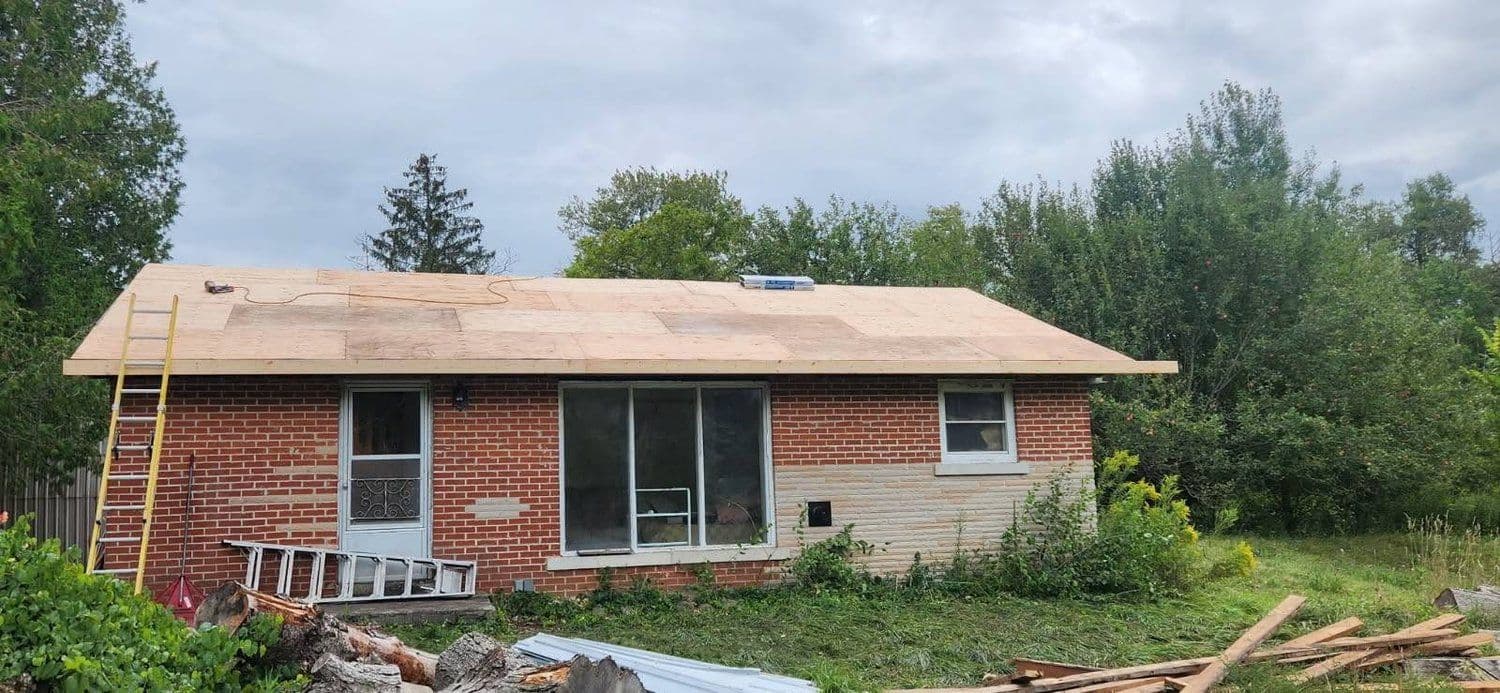 Brick bungalow mid re-roof with fresh decking installed