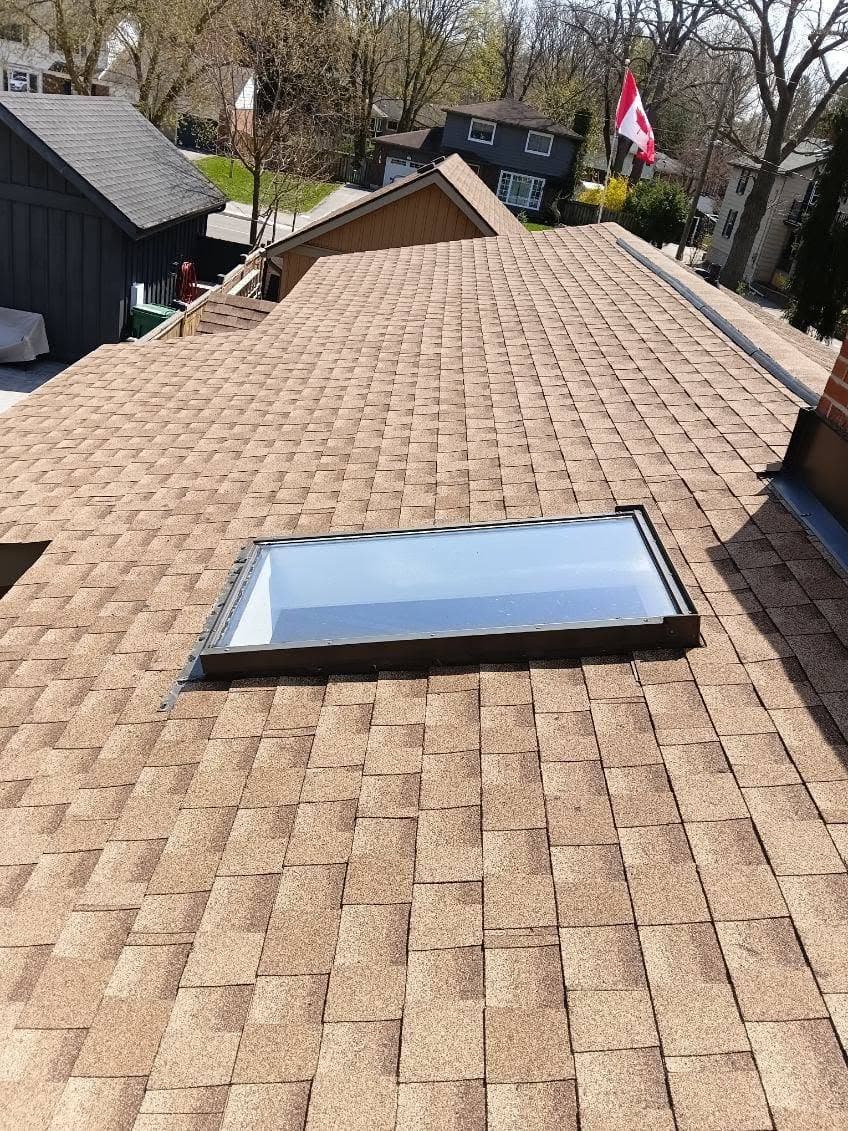 New shingles and re-flashed skylight after the re-roof